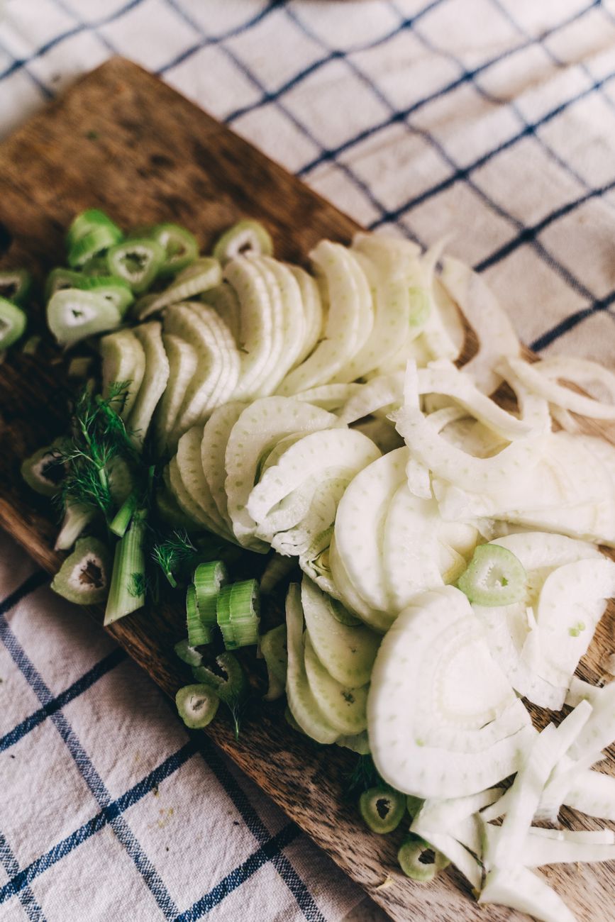 sliced fennel on wooden chopping board