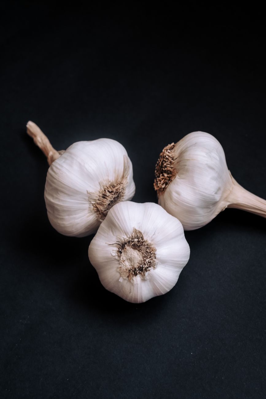 three raw garlics